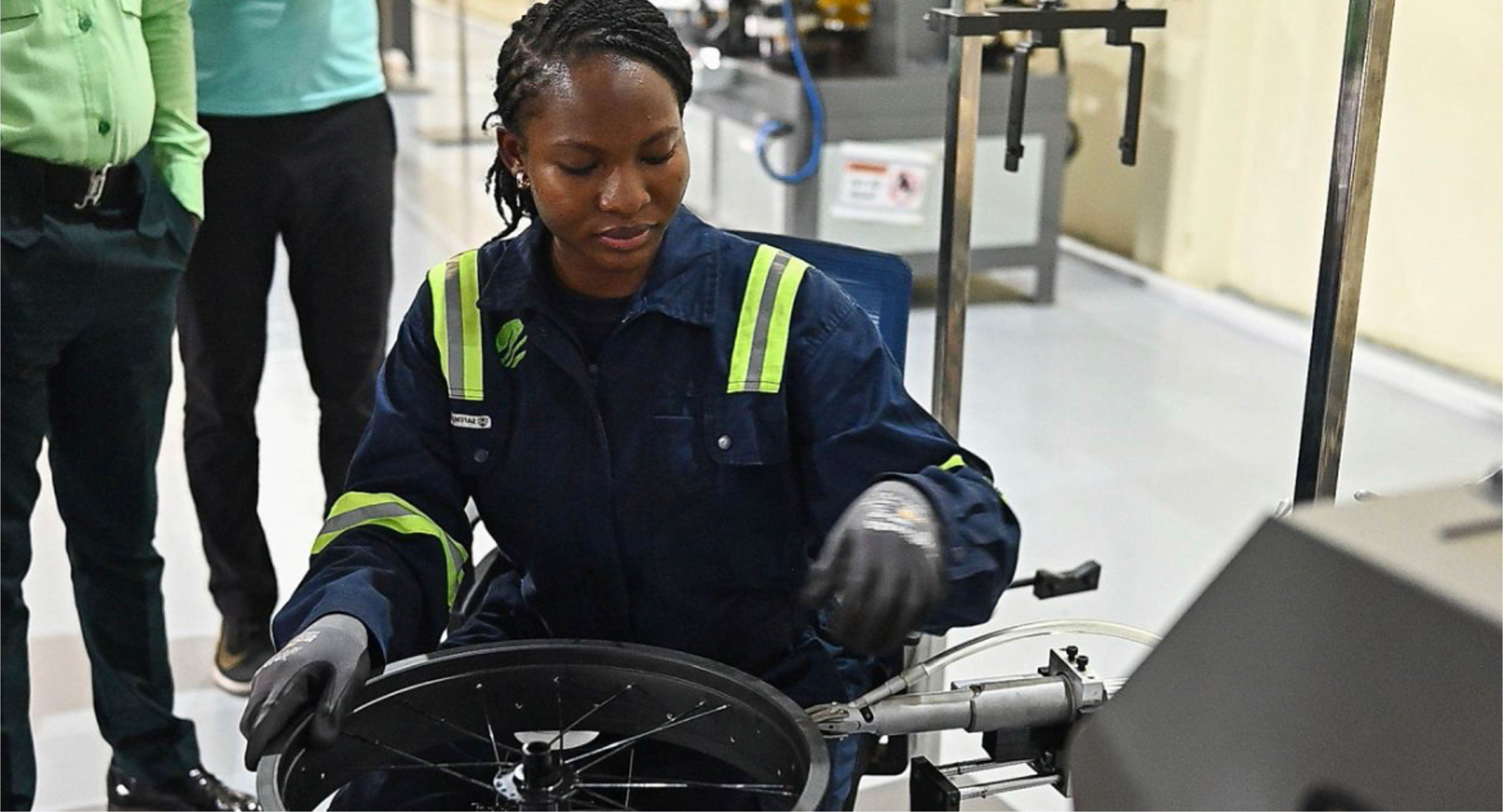 Kezia, a Wahu engineer, working on a wheel on the Accra assembly line