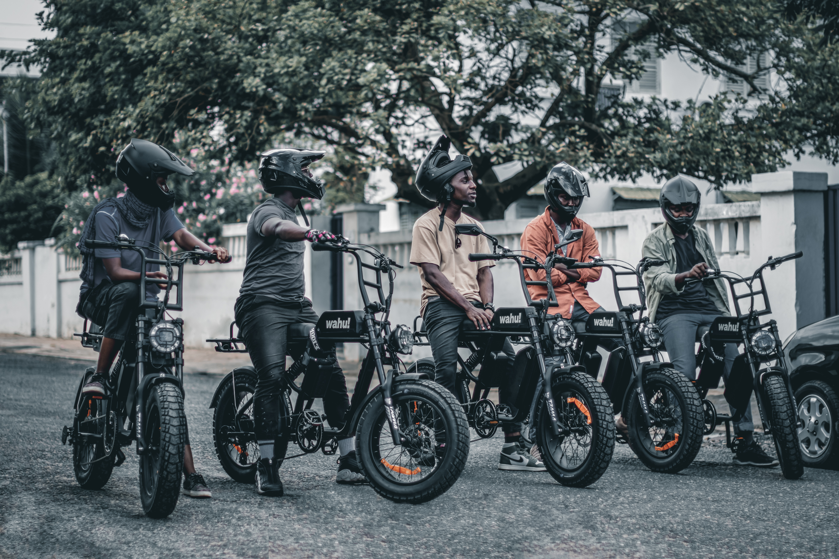 A group of Wahu fleet riders with helmets ready to dispatch