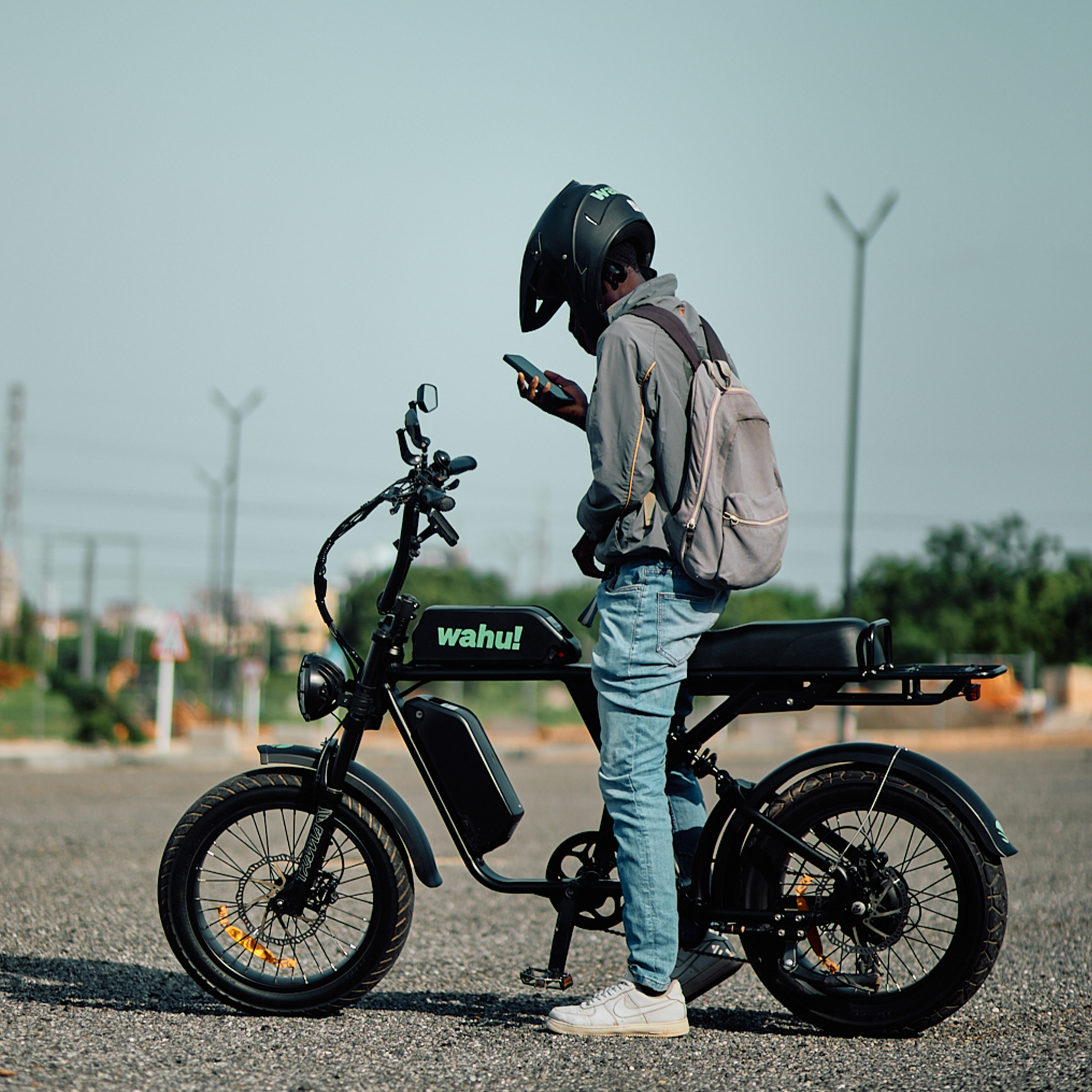 A Wahu rider checking the Hero app next to the eBike